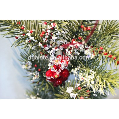 pine tree red fruit branch winter festival decorationwith snowy effect